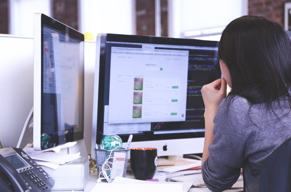 business person in front of computer copy